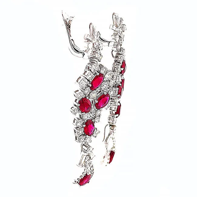 Platinum dangling earrings with no heat Ruby’s and diamonds. Call for price.